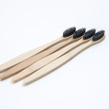 Load image into Gallery viewer, Biodegradable Charcoal Infused Bamboo Toothbrushes (single or set of 4)