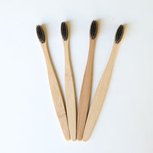 Load image into Gallery viewer, Biodegradable Charcoal Infused Bamboo Toothbrushes (single or set of 4)