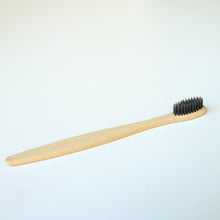 Load image into Gallery viewer, Biodegradable Charcoal Infused Bamboo Toothbrushes (single or set of 4)