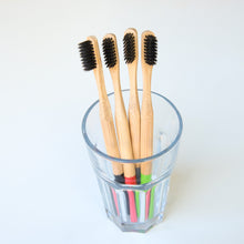 Load image into Gallery viewer, Biodegradable Charcoal Infused Bamboo Toothbrushes (single or set of 4)