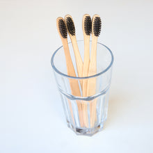Load image into Gallery viewer, Biodegradable Charcoal Infused Bamboo Toothbrushes (single or set of 4)