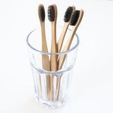 Load image into Gallery viewer, Biodegradable Charcoal Infused Bamboo Toothbrushes (single or set of 4)