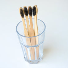 Load image into Gallery viewer, Biodegradable Charcoal Infused Bamboo Toothbrushes (single or set of 4)